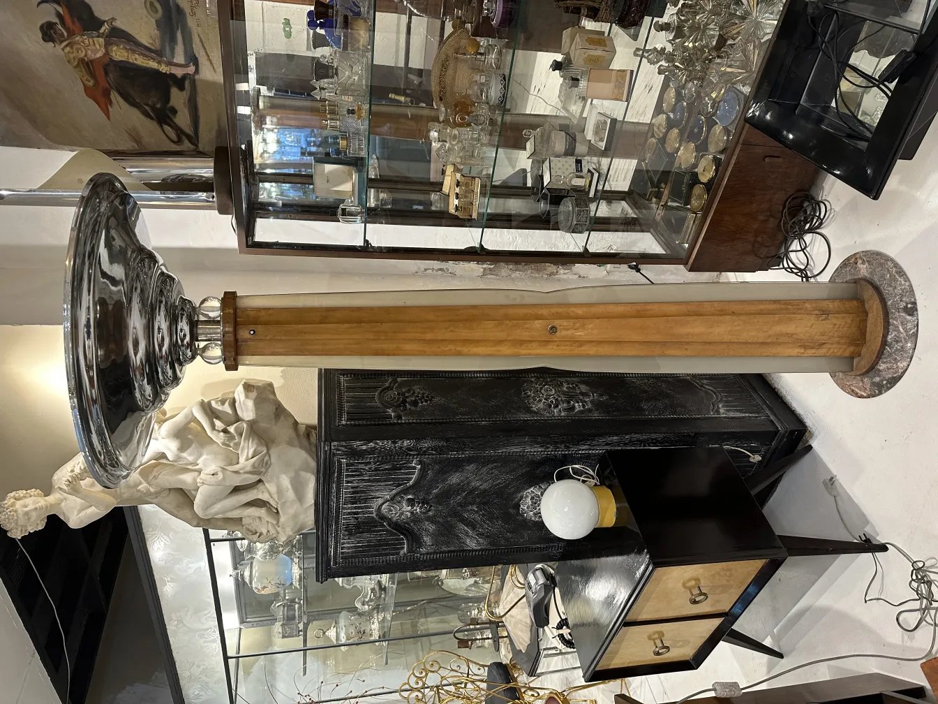 Antique floor lamp with classic details in a vintage setting.