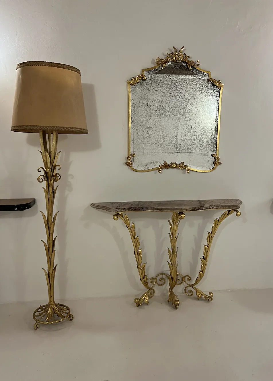 Antique floor lamp with decorative base and beige shade