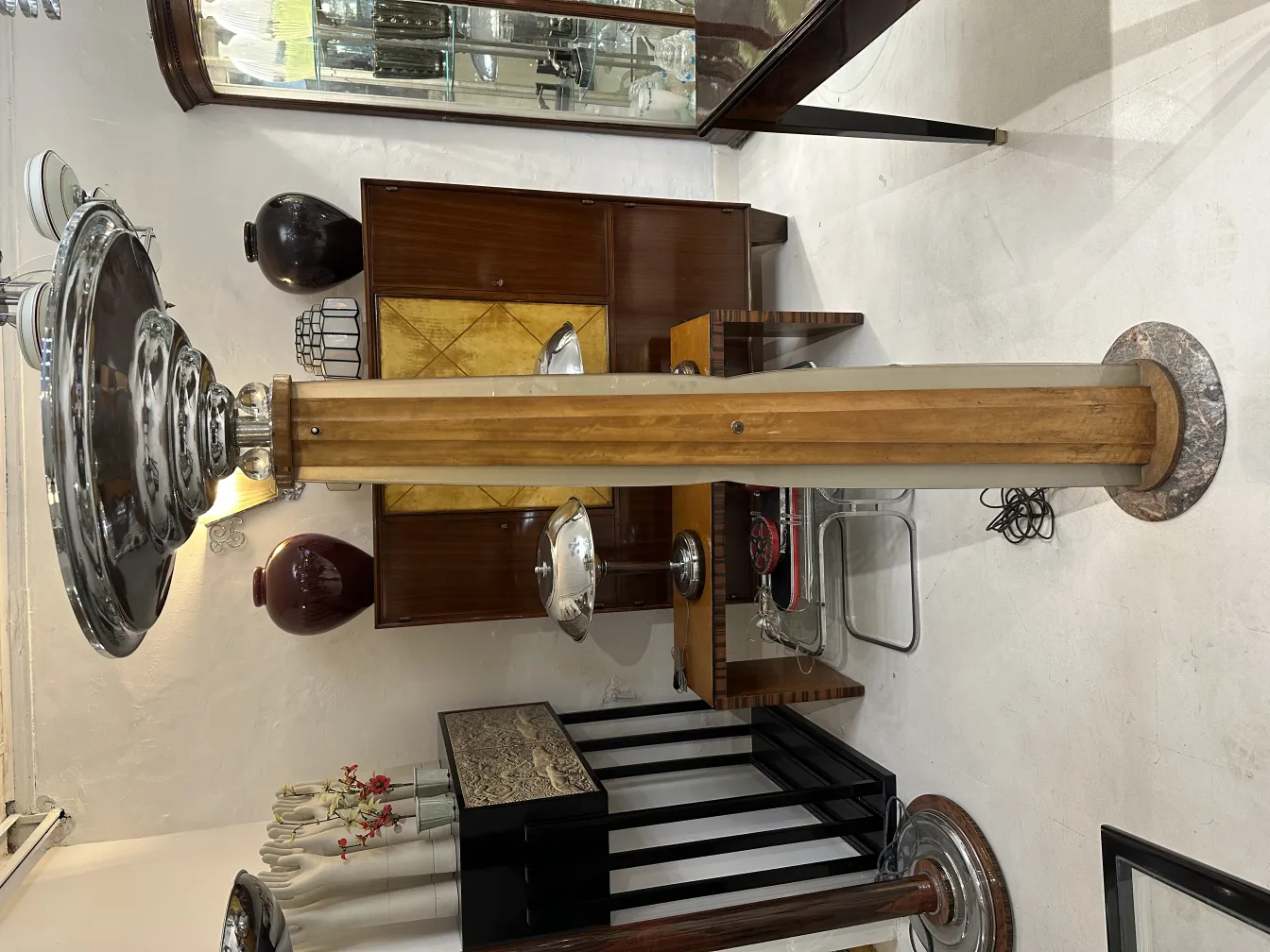 Antique floor lamp, classic style with elegant base and metal details, in antique setting.