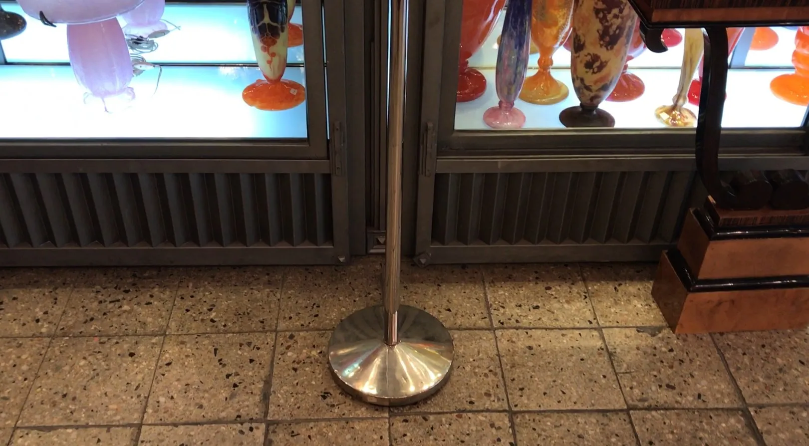 Antique floor lamp with shiny base in decorative setting