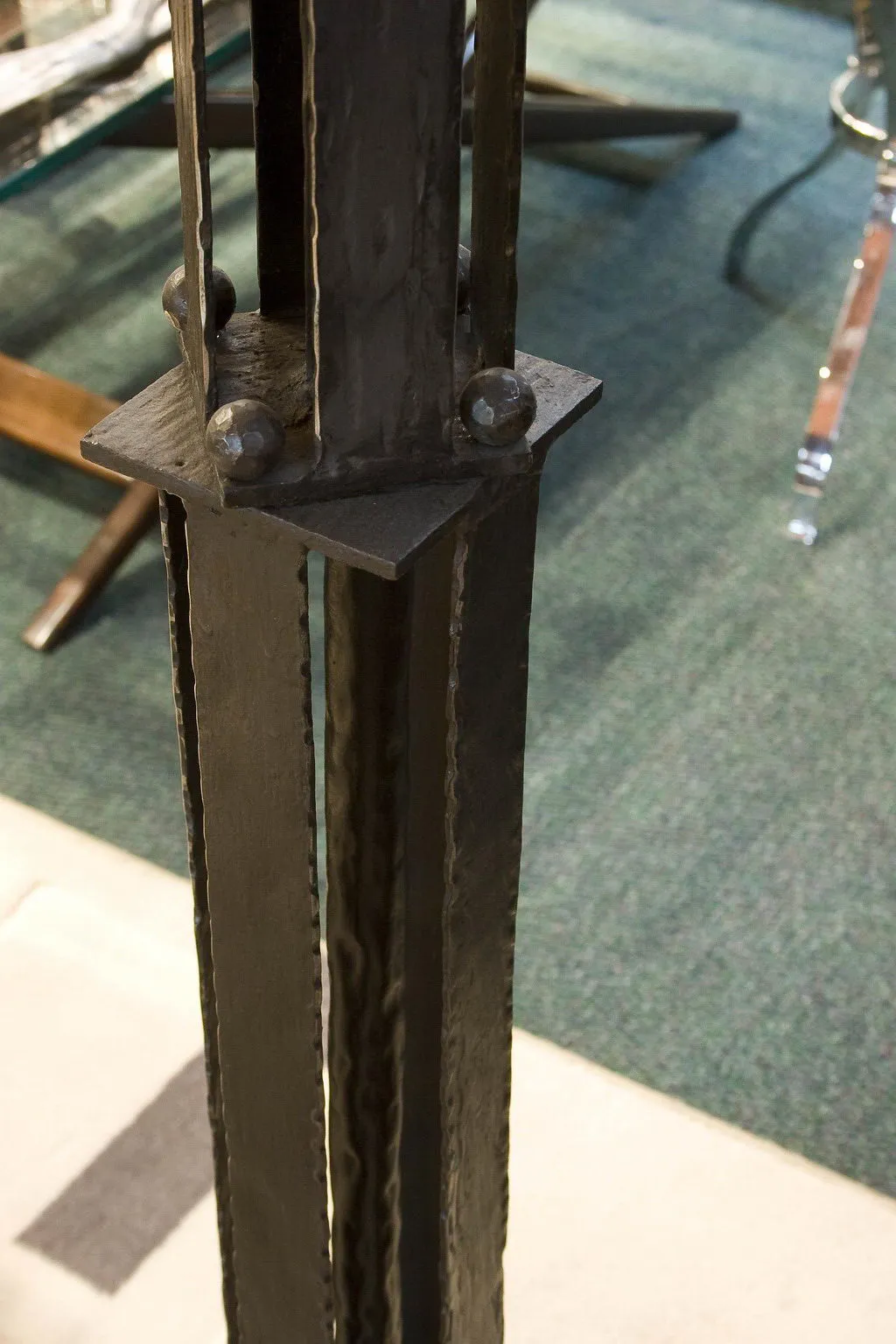 Antique floor lamp with decorative base in a classic setting