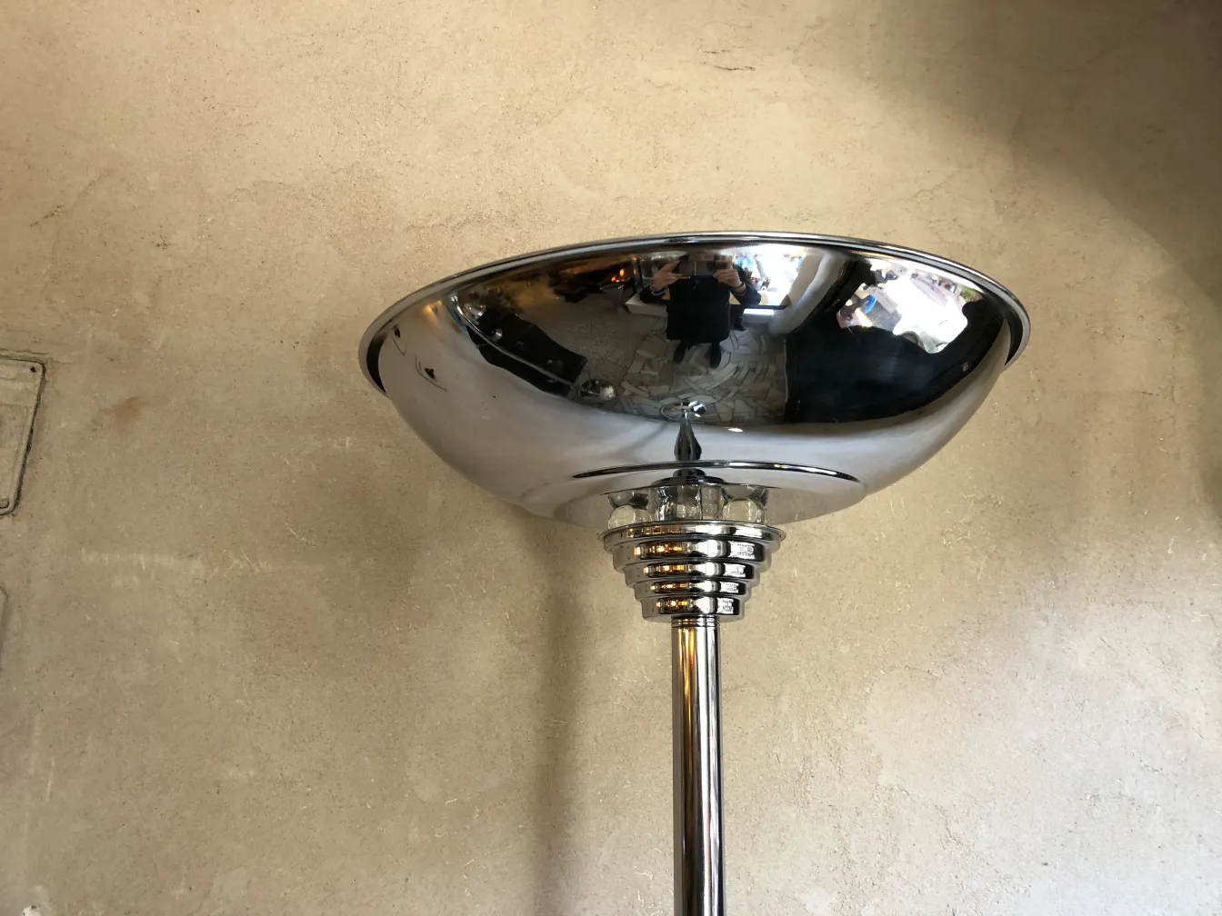 two antique floor lamps shiny in a neutral setting