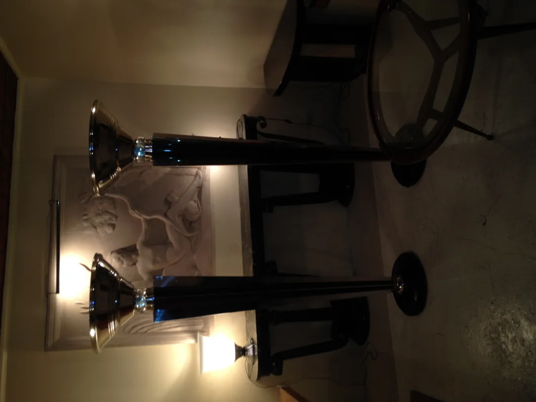 two antique floor lamps with elegant design in a cozy environment