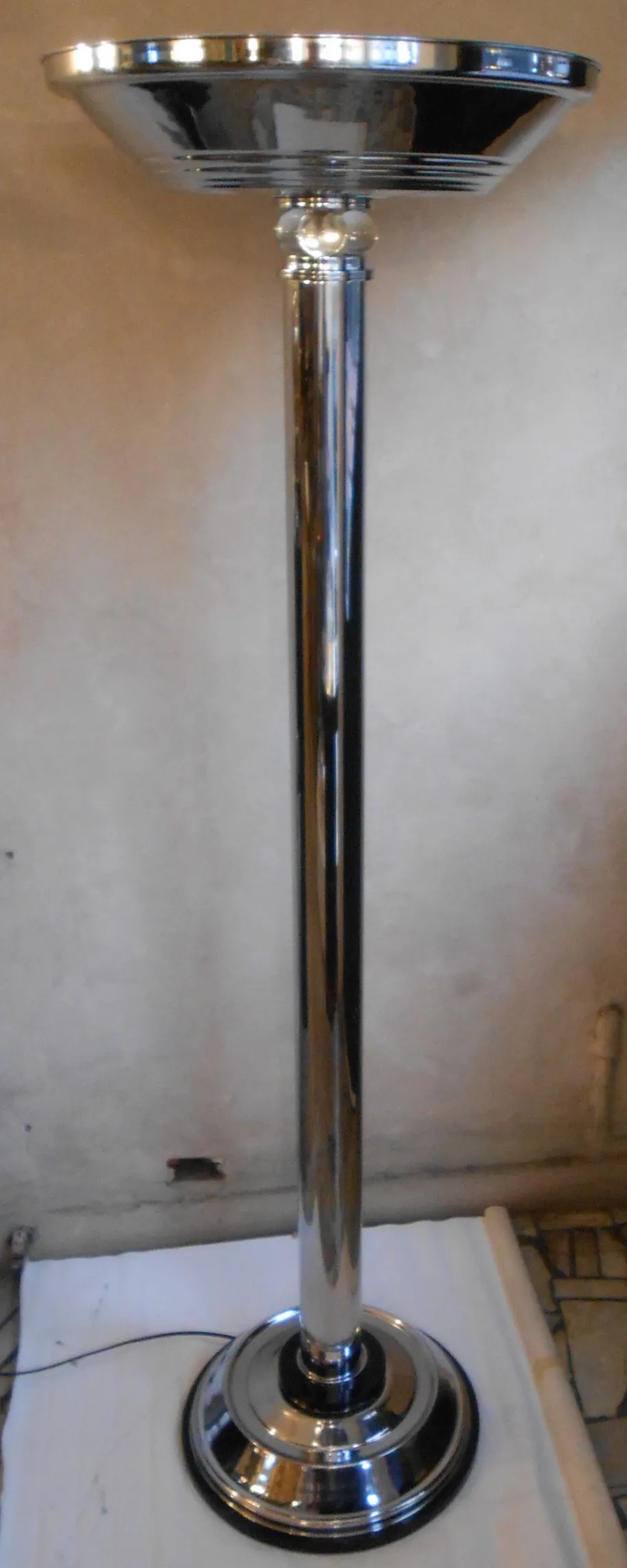 two antique floor lamps shining under light