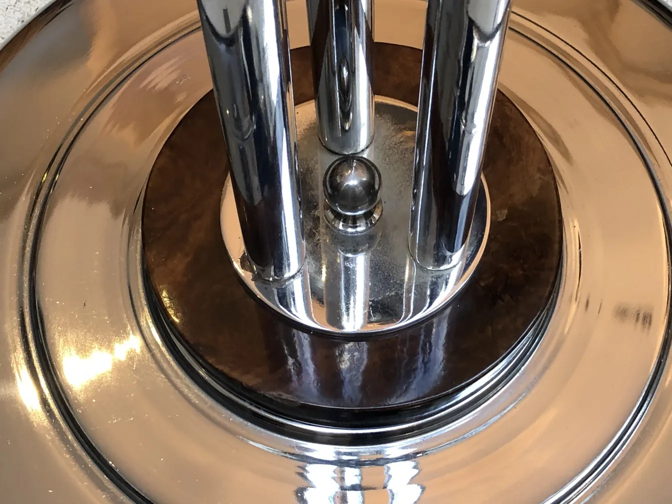 two antique, shiny floor lamps, elegant round base