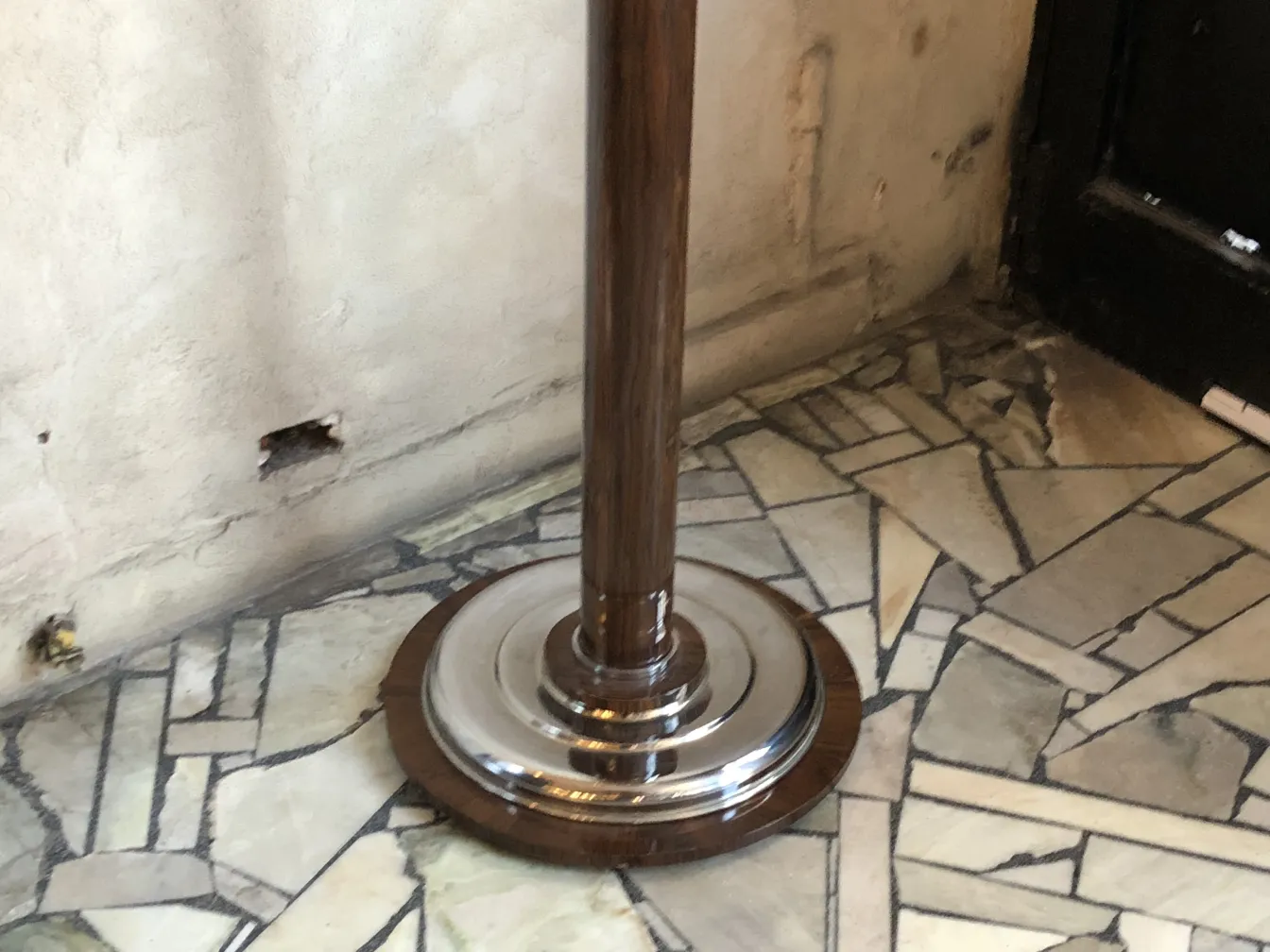 two antique floor lamps with shiny base in the corner