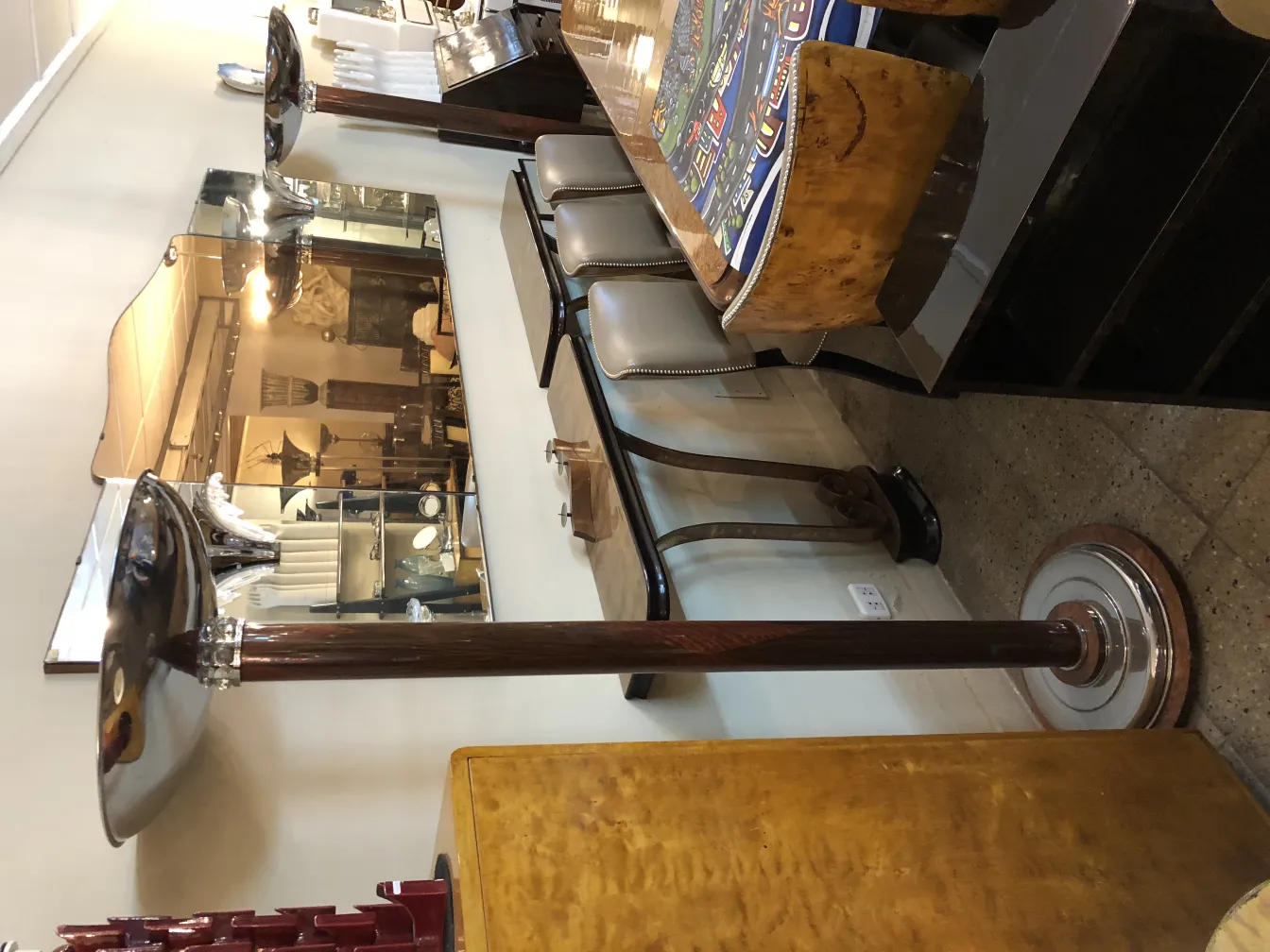 two antique floor lamps with elegant bases in a sophisticated setting