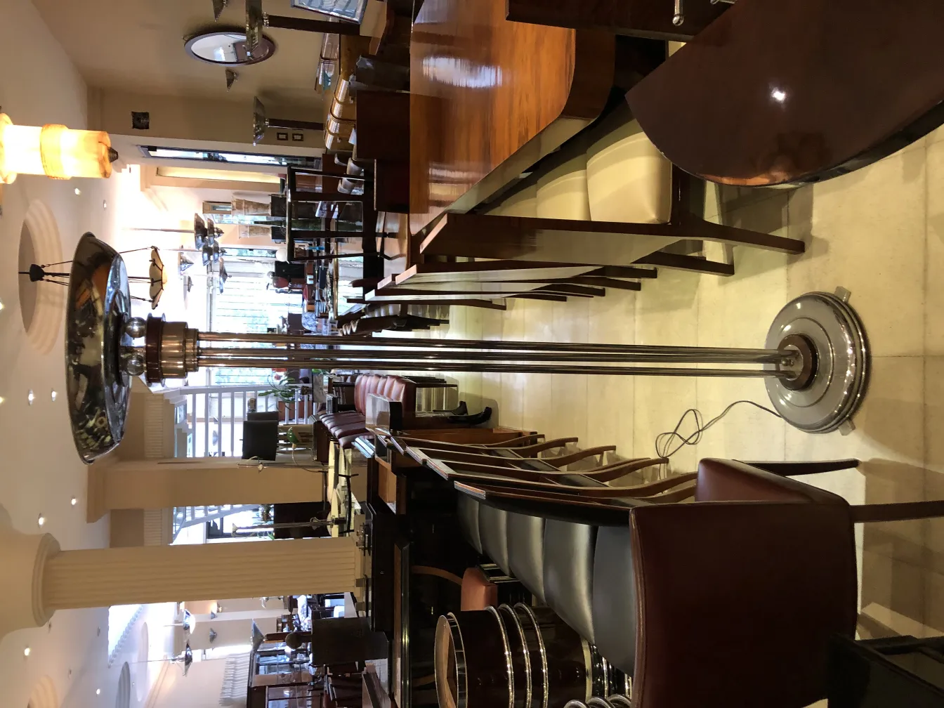 two antique floor lamps in a moderate setting