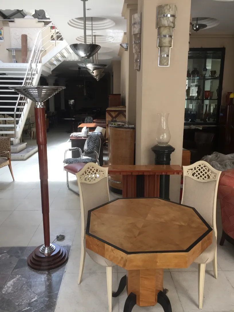 View of two antique floor lamps in an elegant living room with a cozy style.