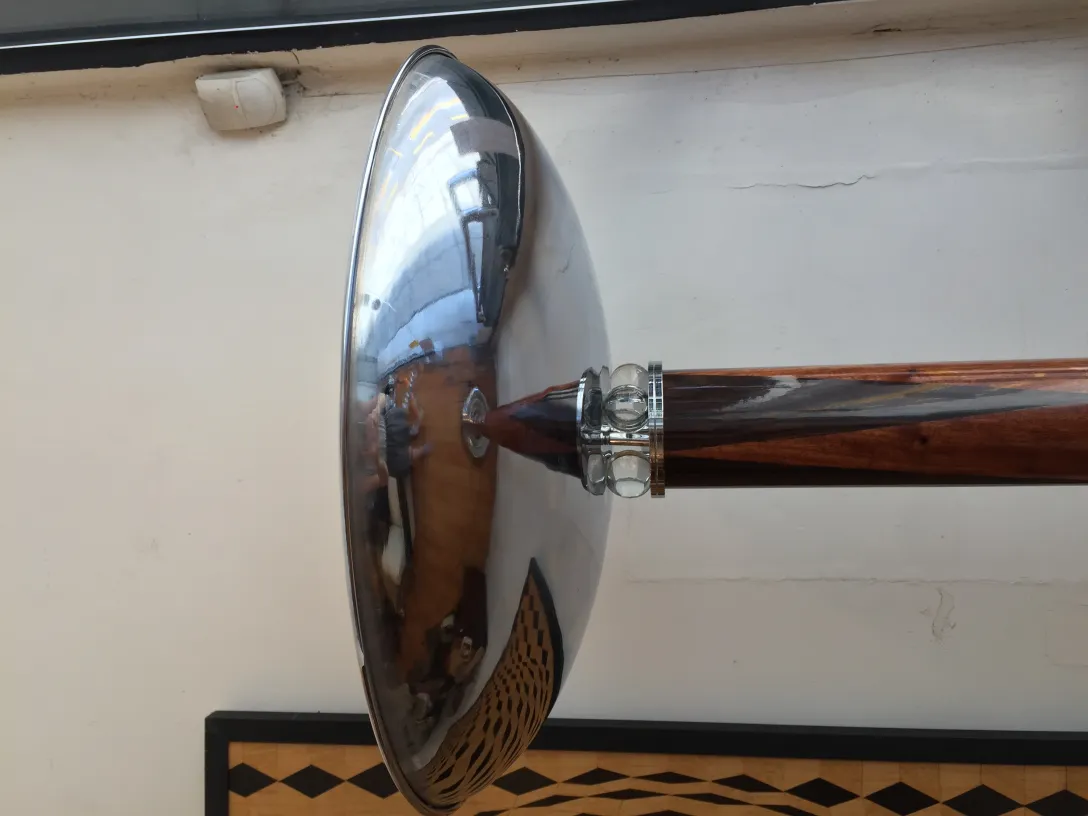 Two antique floor lamps with shiny shades in an elegant setting