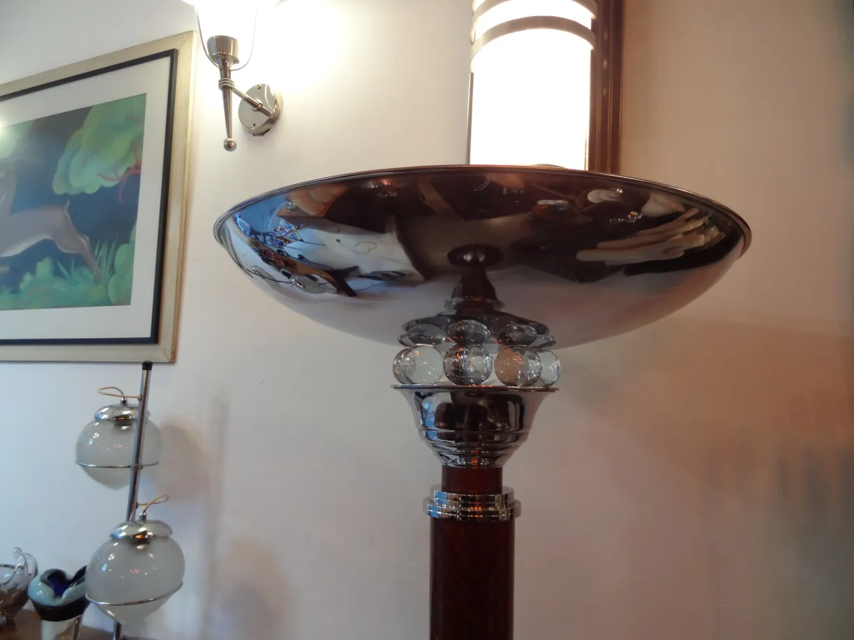 Close view of 2 antique floor lamps with decorative base and round shade