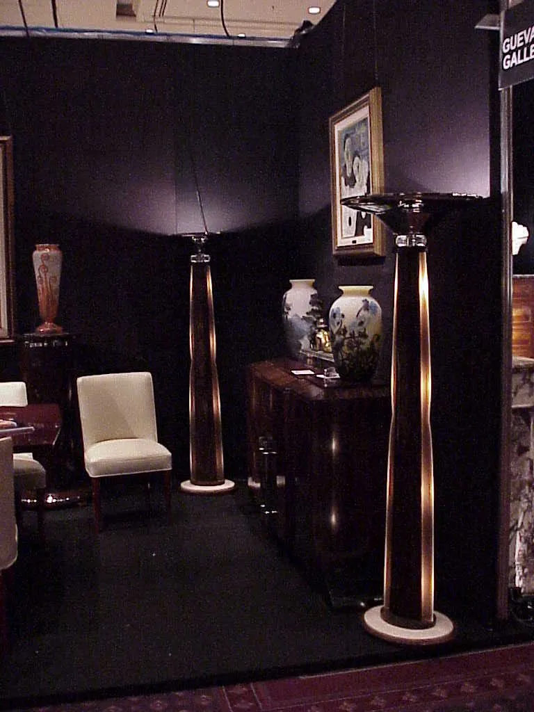 Antique floor lamps brightening a cozy exhibition space.
