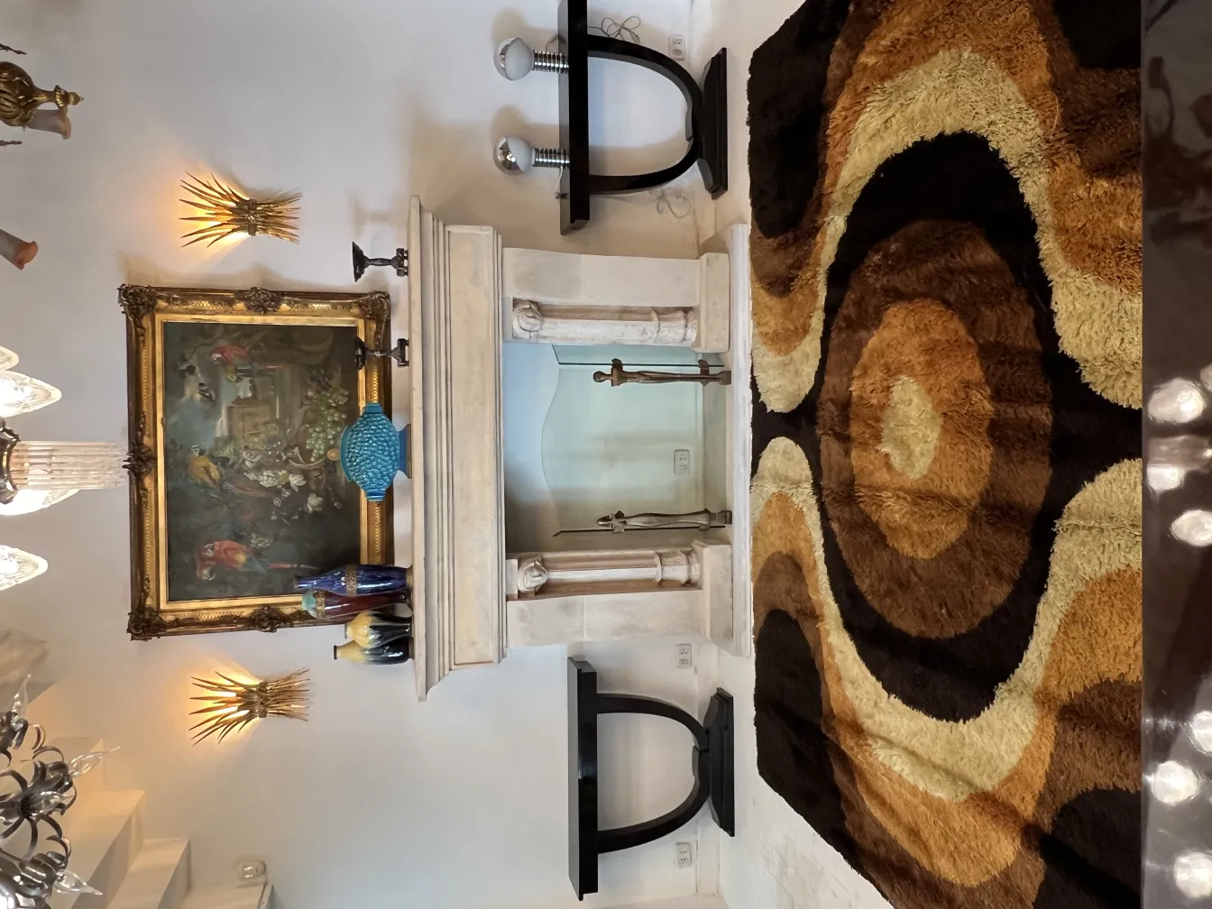 antique carpet with circular patterns in earth tones