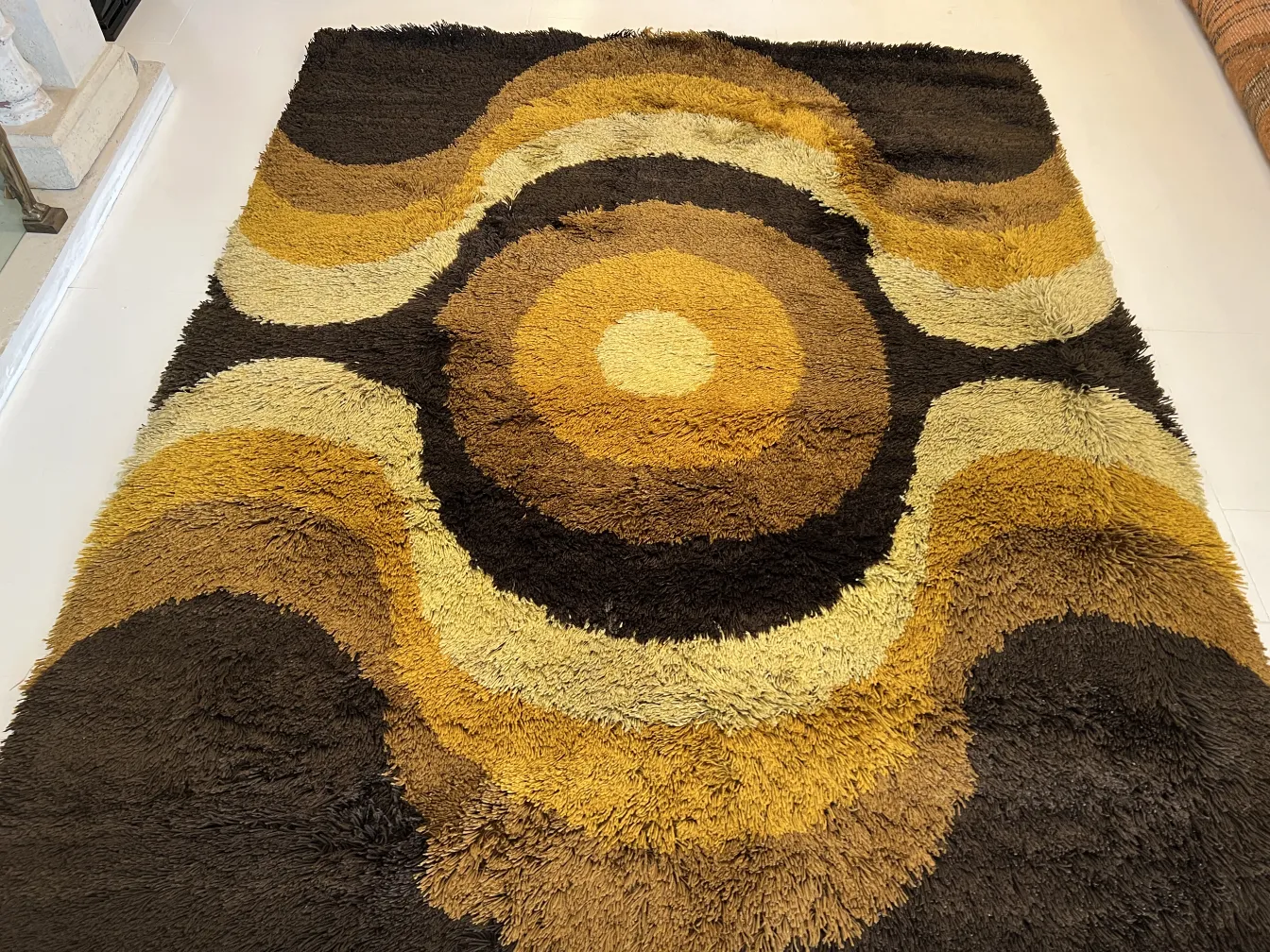 vintage carpet with patterns in brown and yellow tones