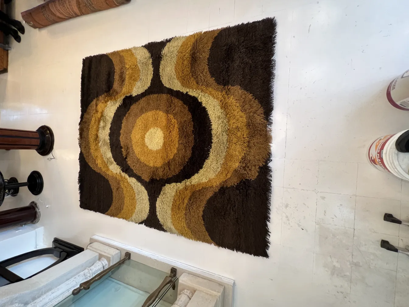 antique carpet with an abstract design in brown and yellow tones
