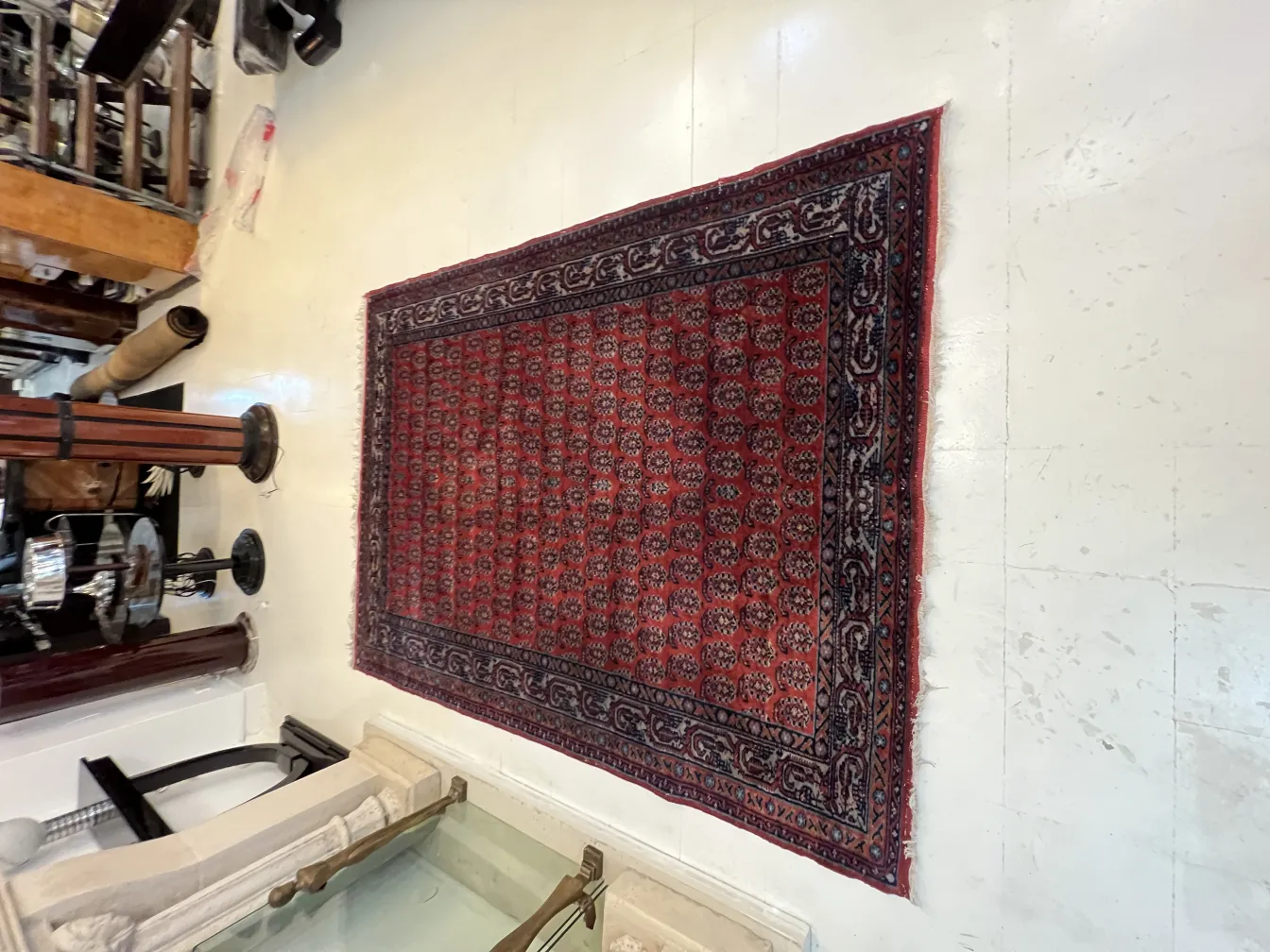 antique red and black carpet in a room