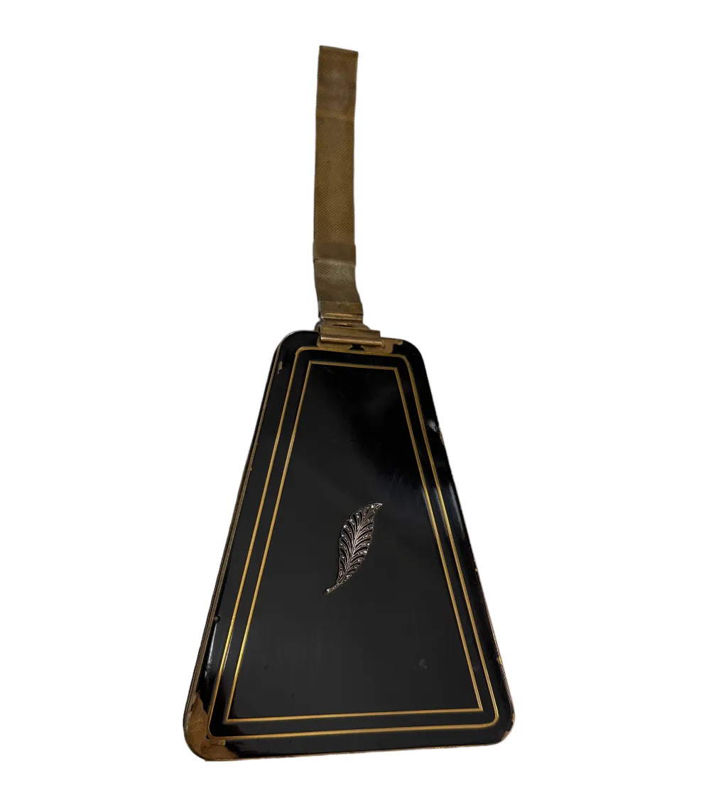 Antique bag with art deco design, black and gold color, triangular shape.