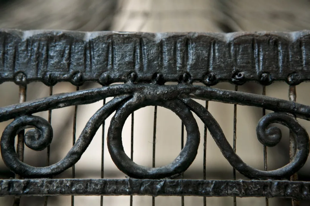 antique cage with artistic decoration in curved metal