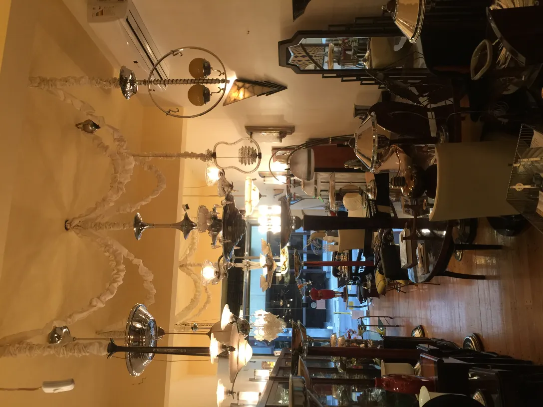 Two antique hanging lamps in a styled room