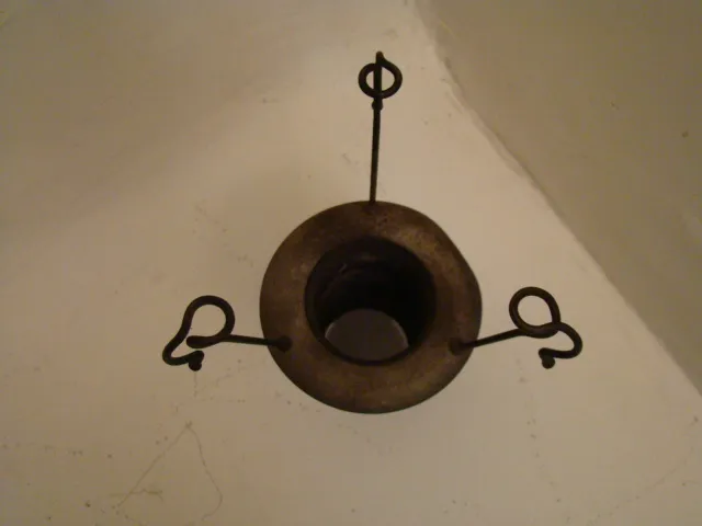 Top view of 2 antique hanging lamps with circular shape in a bright environment.