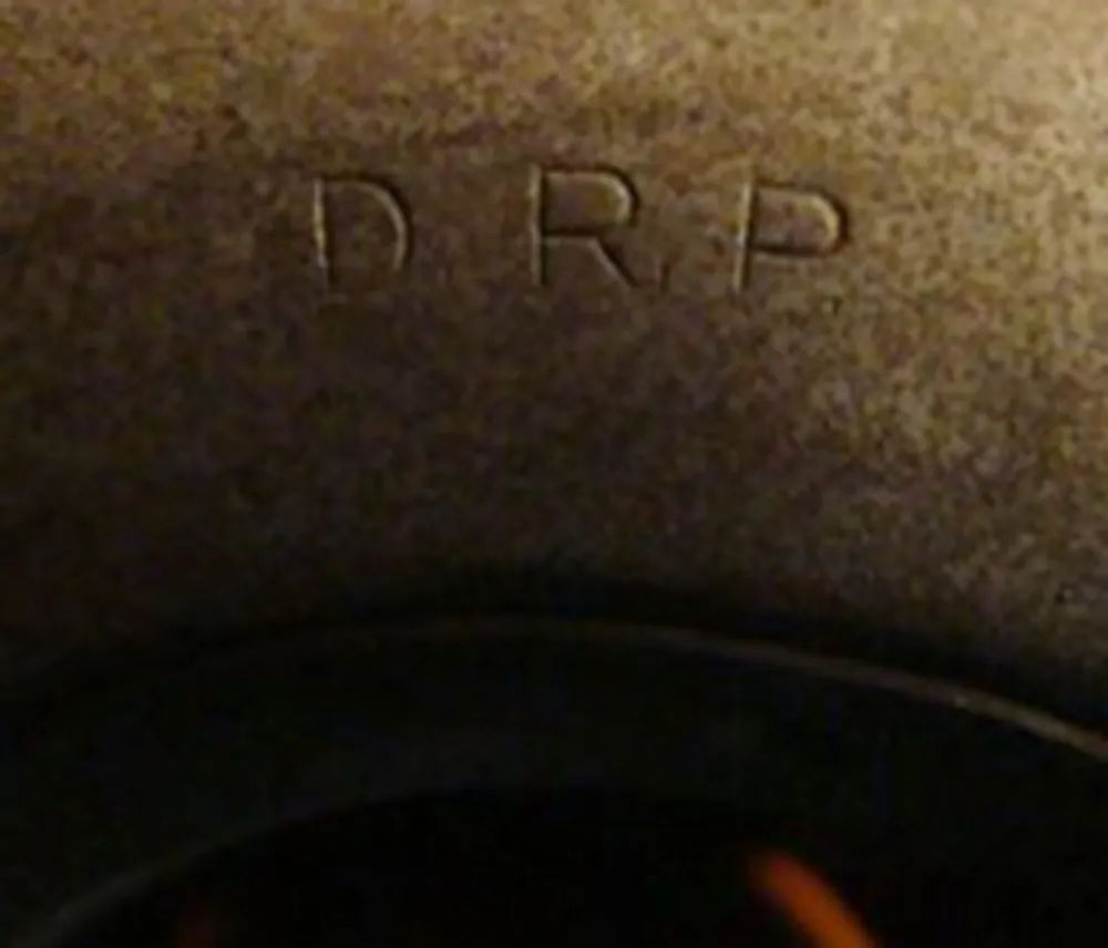 Image of two antique hanging lamps, visible design details