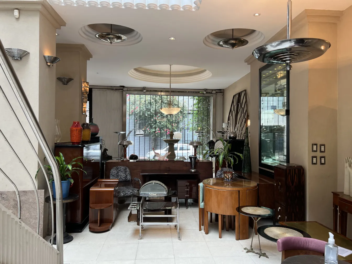 Images of 2 antique hanging lamps in a modern setting.