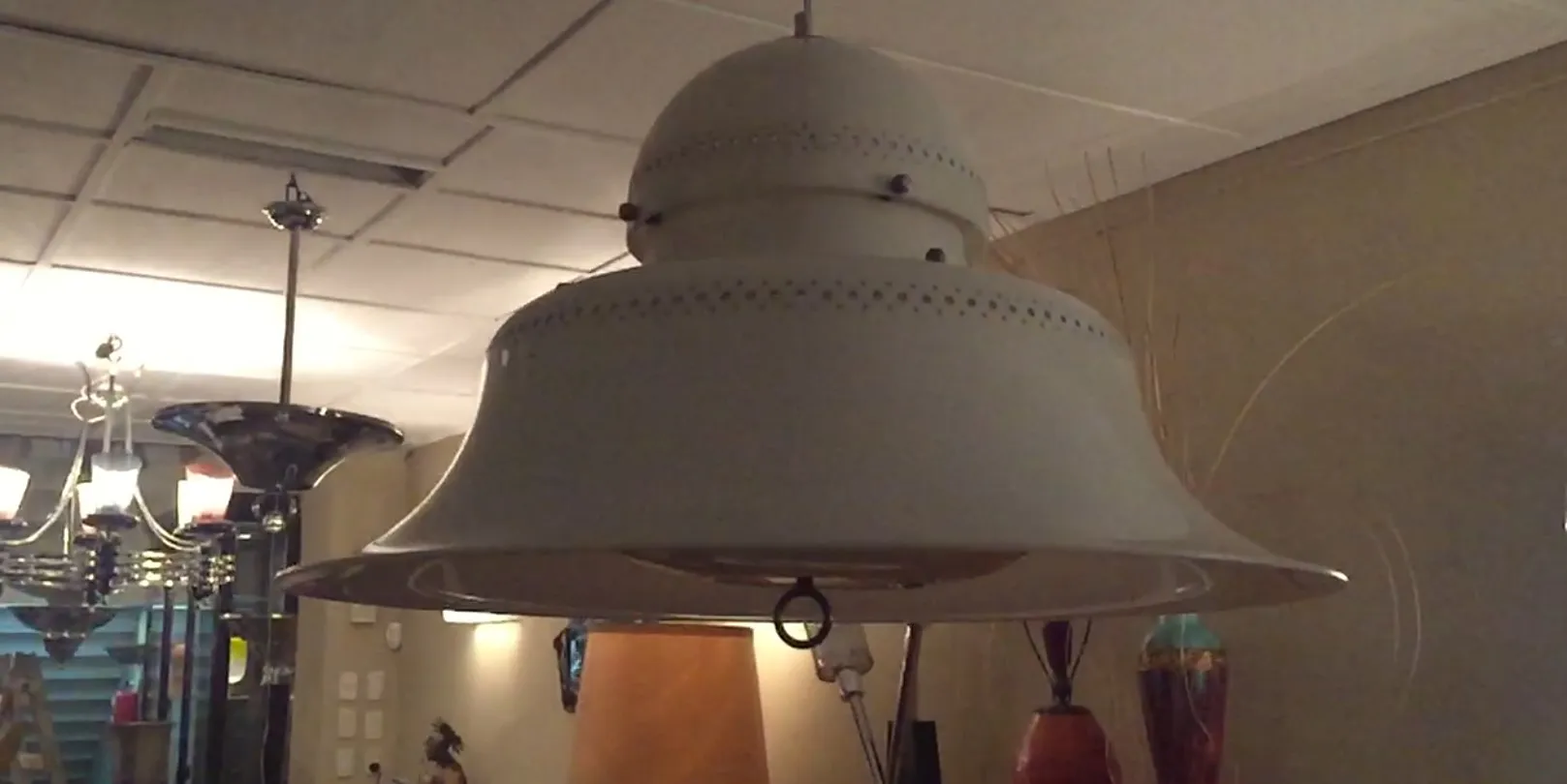 Two antique hanging lamps in a decorative setting