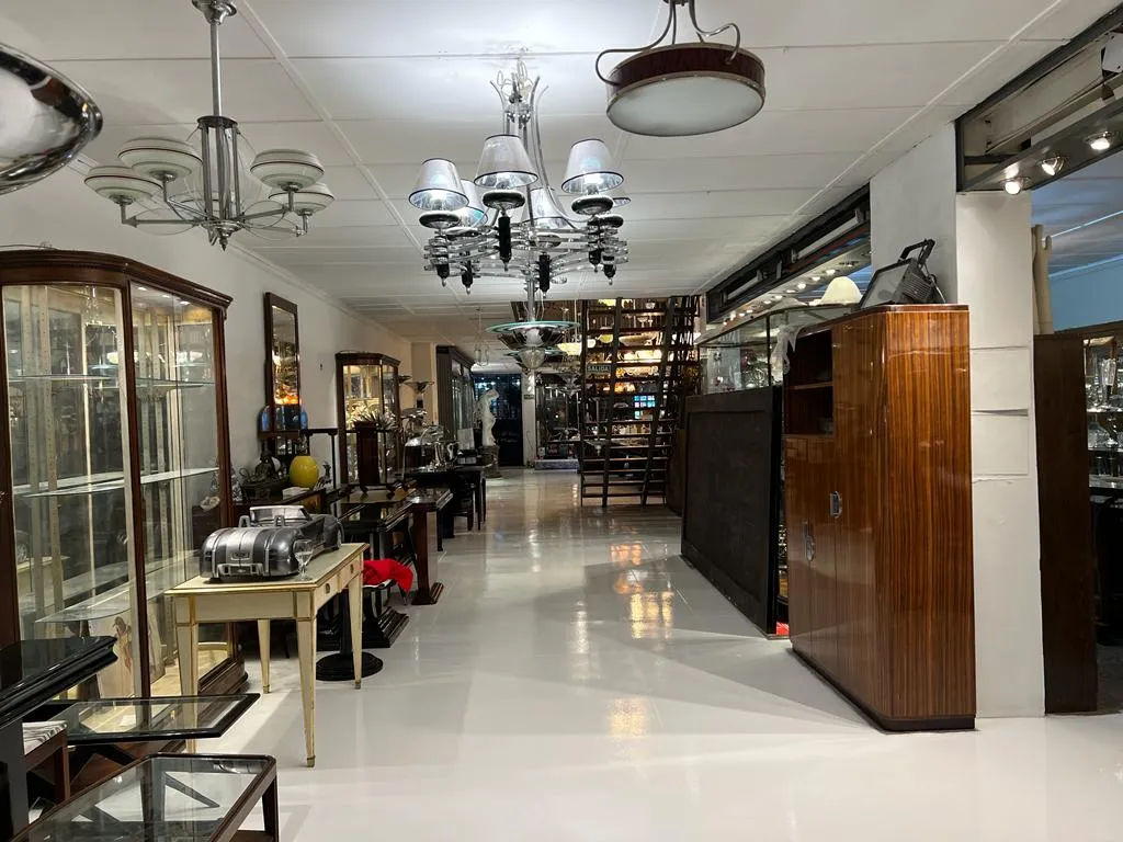 Two antique hanging lamps decorative in a gallery with showcases