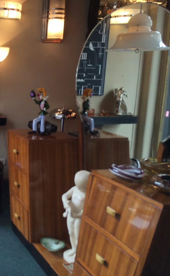 Two antique hanging lamps illuminating a room