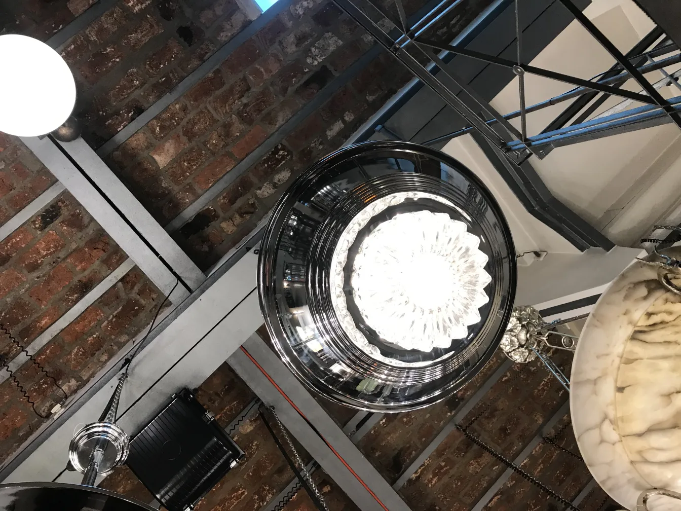 two vintage hanging lamps with glossy finishes