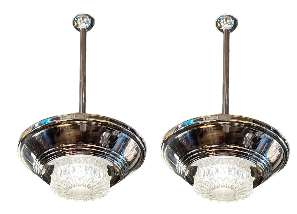2 antique hanging lamps with shiny details in an elegant setting
