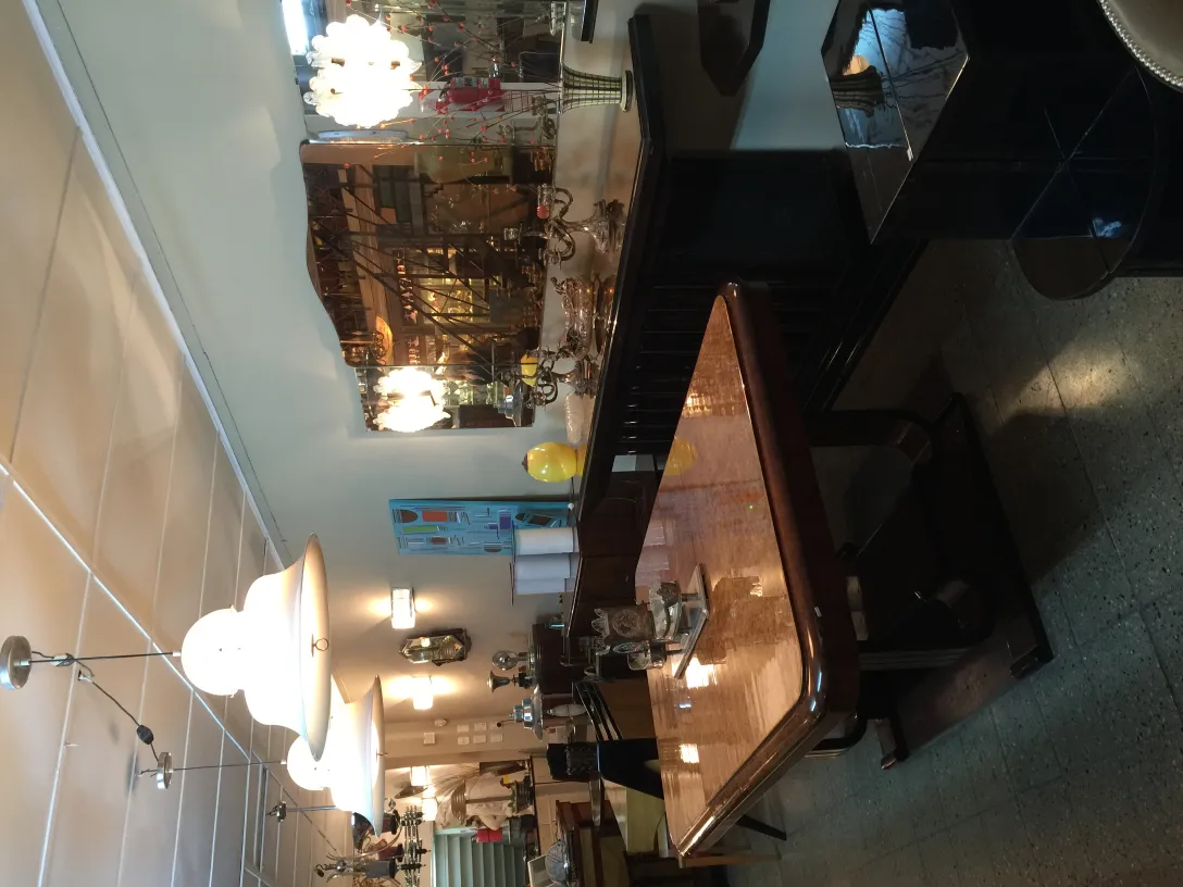 two antique hanging lamps in a warm, lit environment