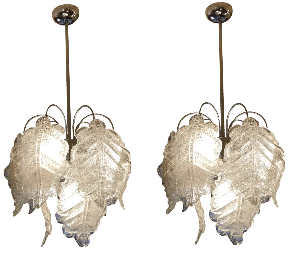 View of two antique hanging lamps featuring shiny leaf design
