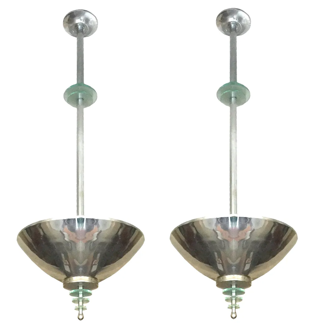 Two antique hanging lamps with a conical shape and shiny metal.
