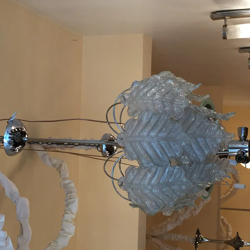 two elegant antique hanging lamps with decorative leaves