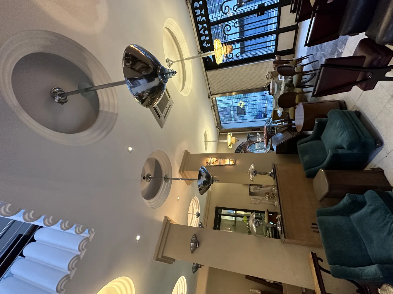 two antique hanging lamps in a cozy restaurant