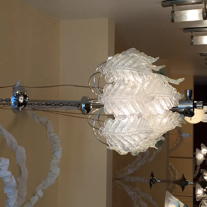 2 antique hanging lamps with leaf design, in a cozy setting