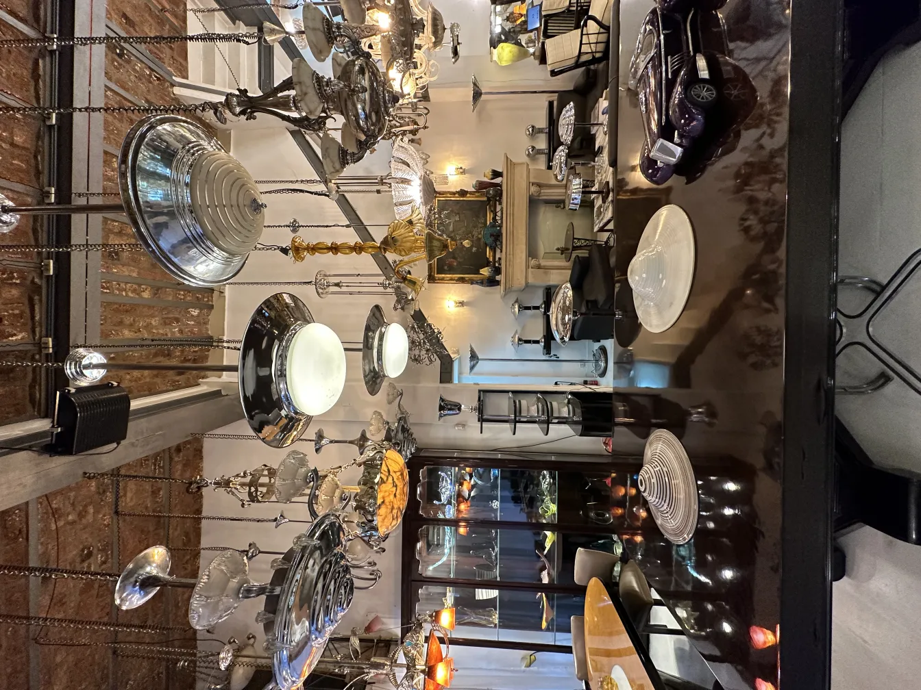 Two antique hanging lamps in a decorative setting