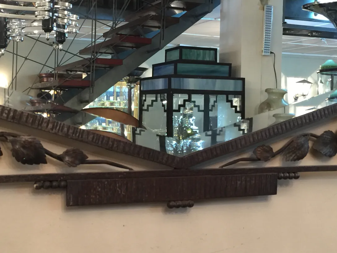 antique mirror with decorative details on the top