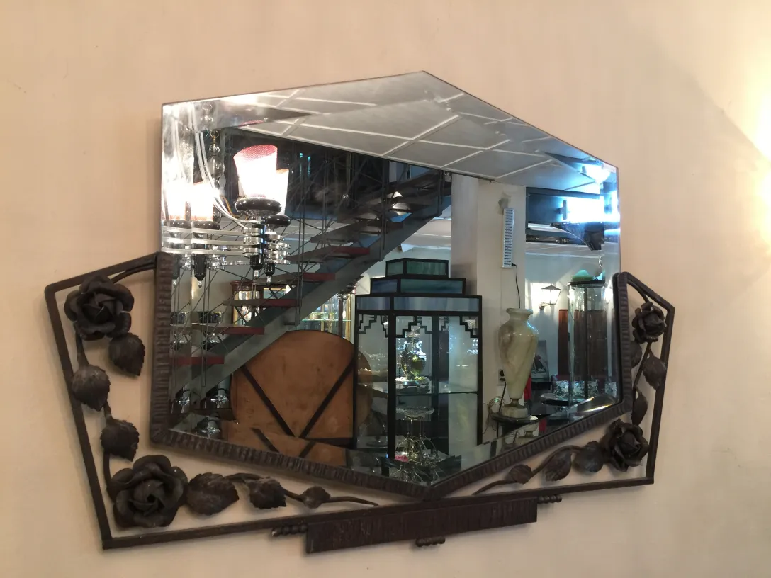 Antique mirror with floral decorations and reflections