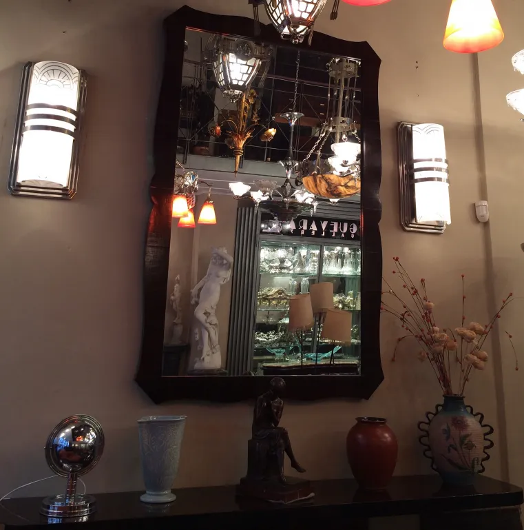 antique mirror with decorative frame and lighting