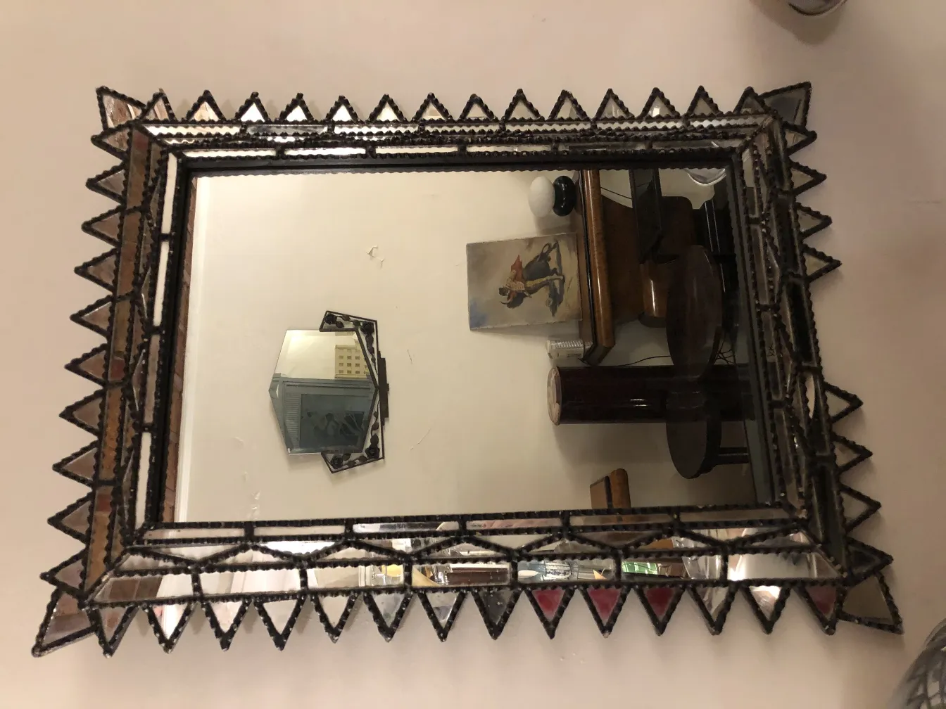 decorative antique mirror with an intricate frame