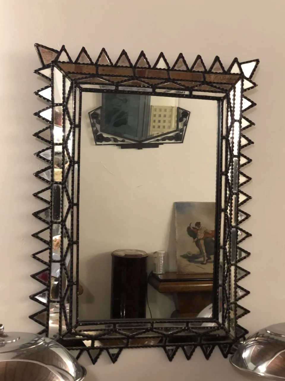 antique decorative mirror with beveled edges and ornate design, cozy environment