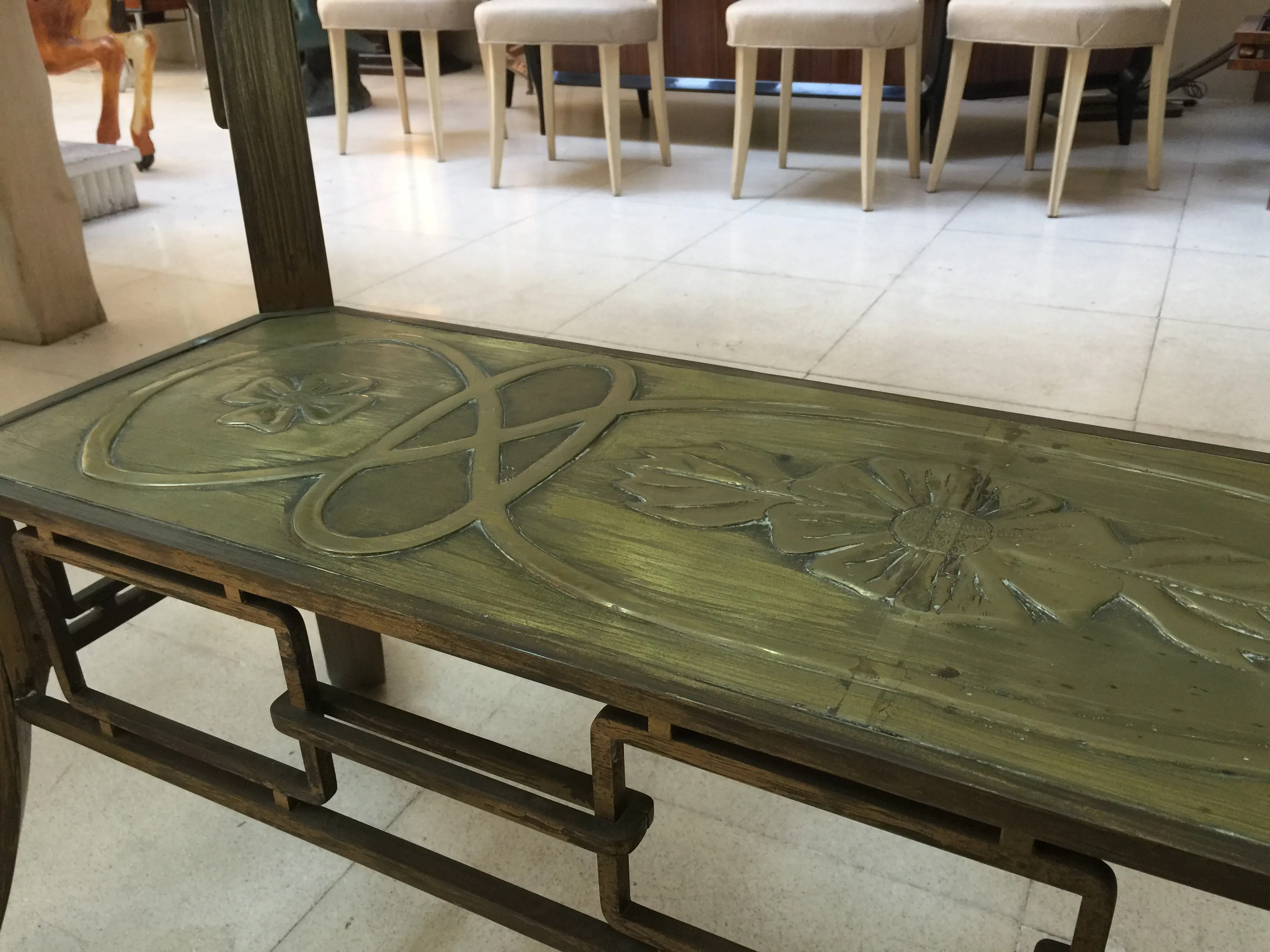 antique dining table with art deco carvings and chairs