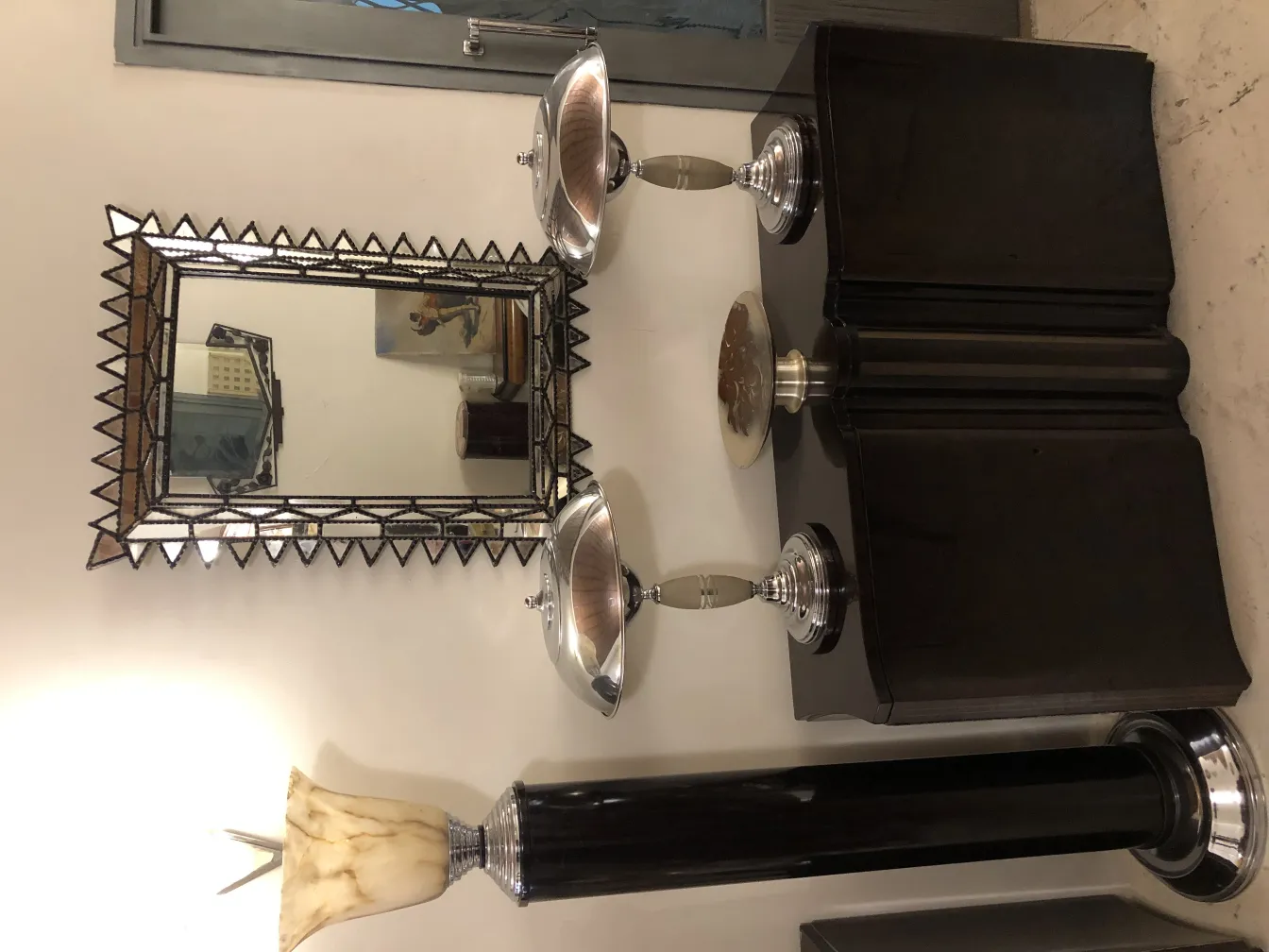 Antique decorative mirror with pointed frame, in an elegant setting