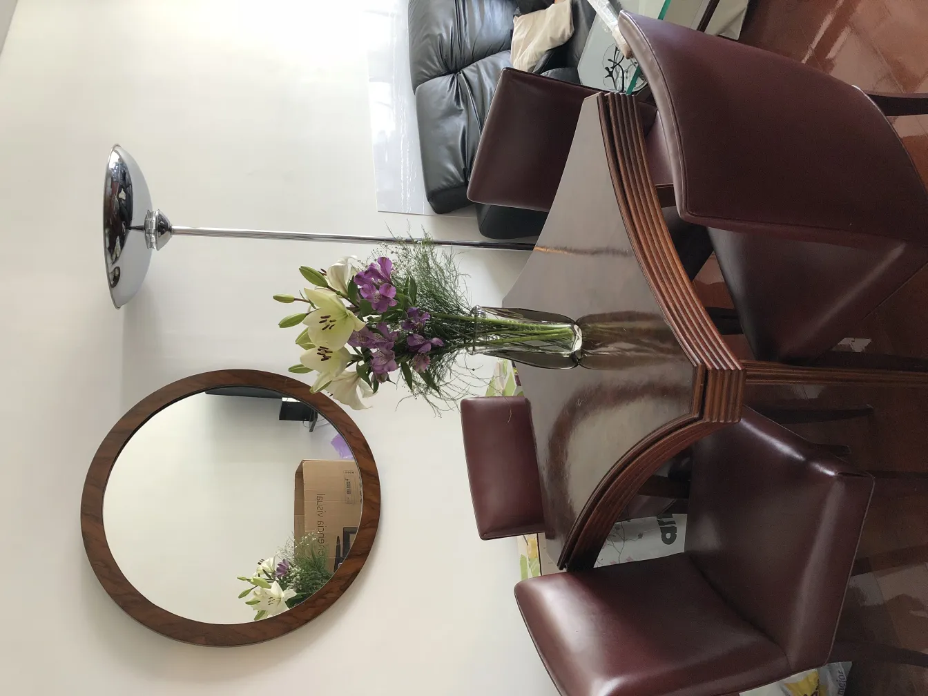 antique round mirror in a modern decor