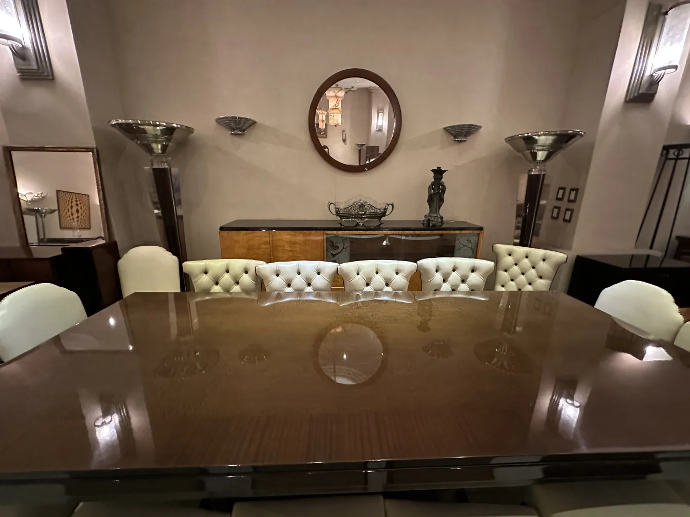 antique round mirror in an elegant living room with furniture