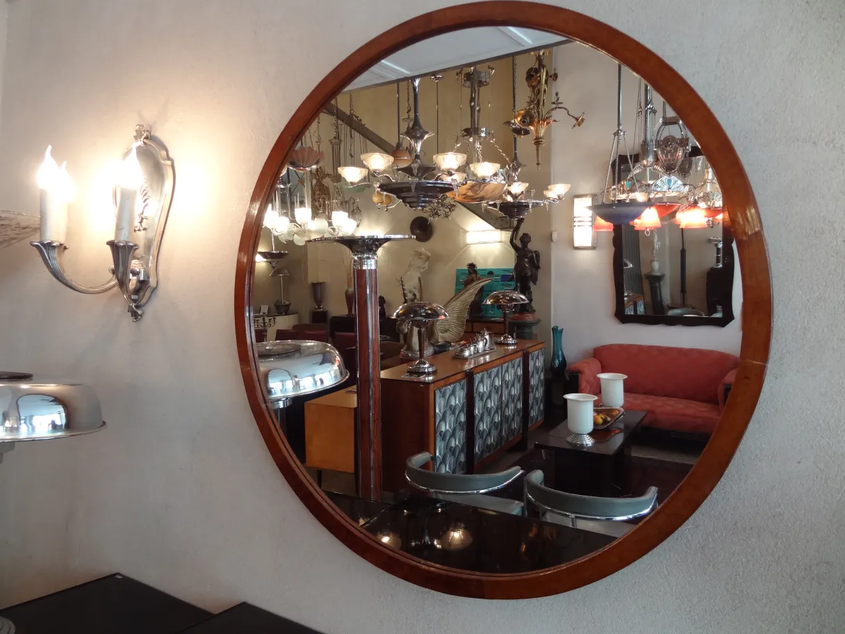 antique round mirror reflecting a cozy setting
