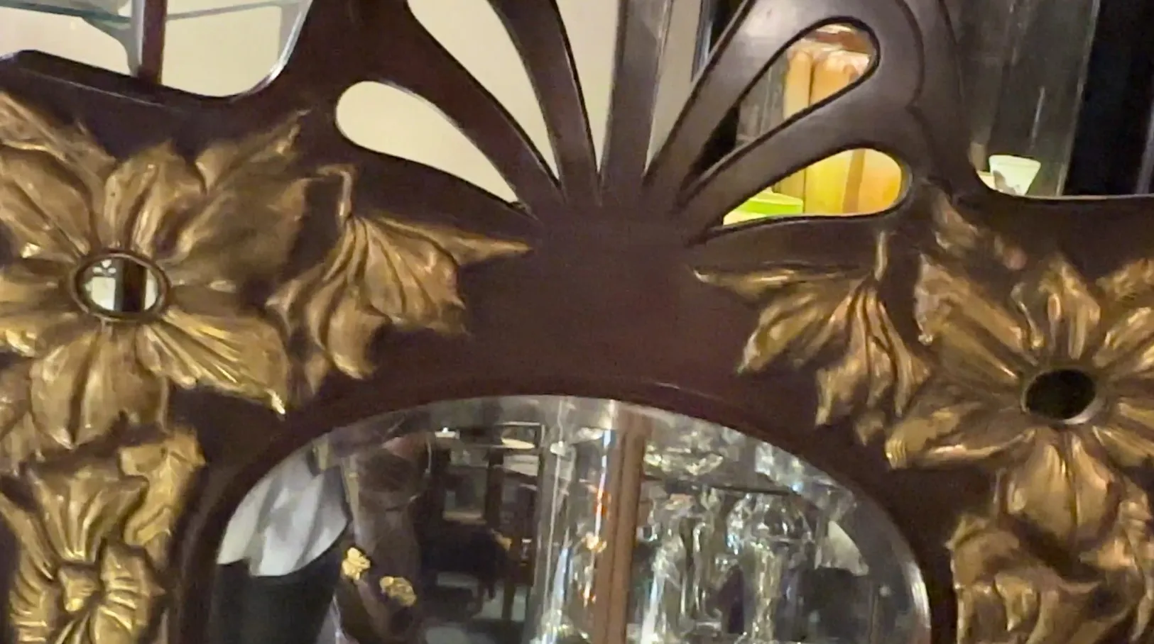 antique mirror with decorative leaf-shaped frame