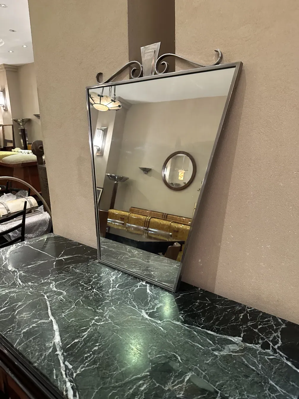 antique mirror with decorative design in an elegant setting